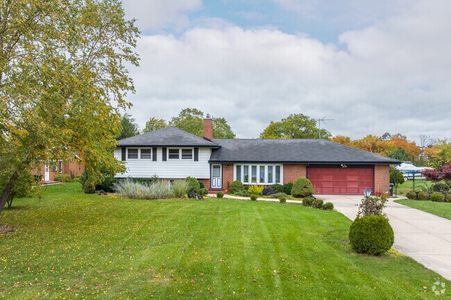 This house sits on one of the larger lots found in Birch Manor.