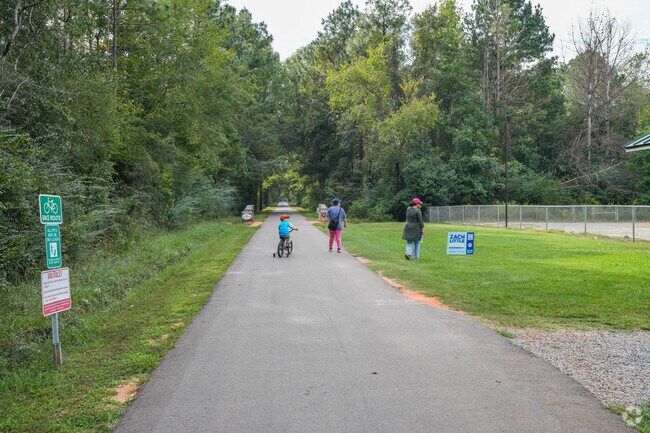 Families enjoy quality time together while walking along Longleaf Trace.