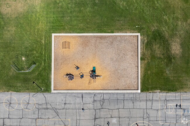 Concrete borders frame Academy Park Elementary School’s playground.