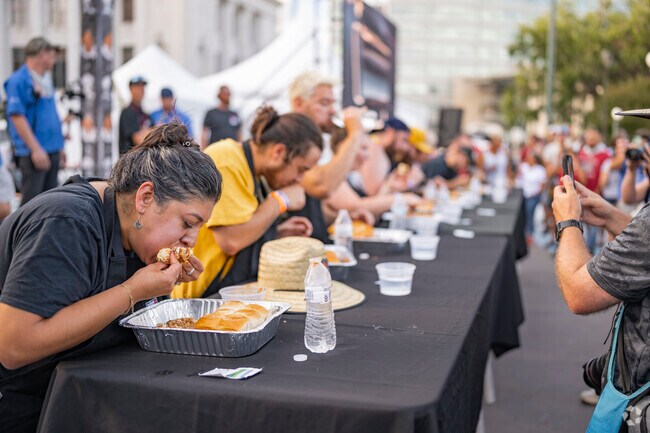 The slider eating contest is underway at BBQ Fest Denver in the Central Business District.