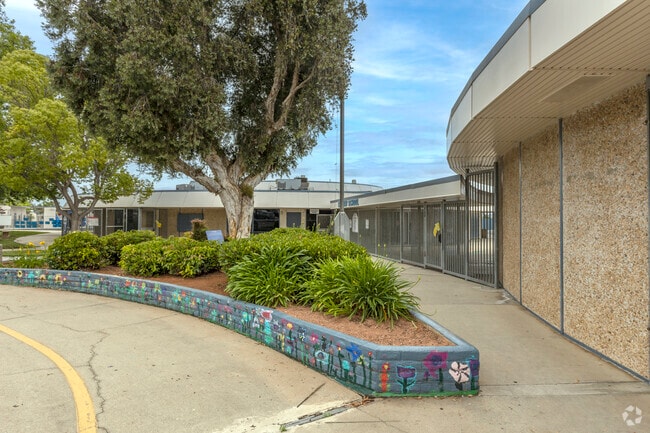 Students paint flowers at the entrance area of the Conway Elementary School in Escondido.
