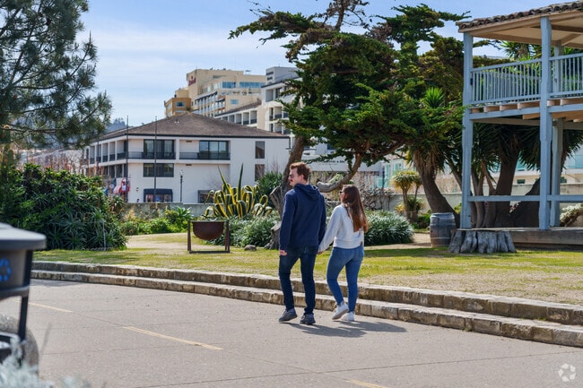 Couple strolling through scenic downtown Monterey near Prunedale.