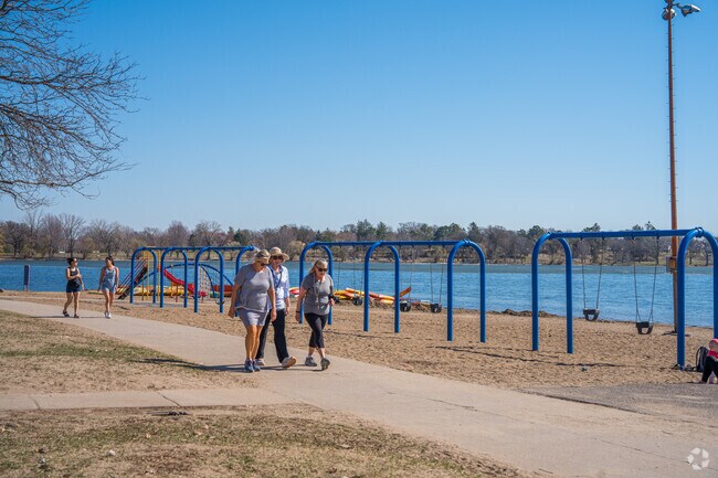 Lake Nokomis Beach has a playground and walking trails for residents to enjoy.