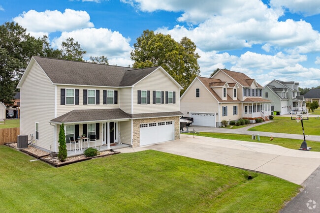 Newer 2-story Traditional homes line a street in Brice’s Creek.