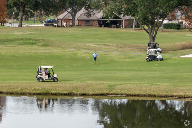 Golfers of Youngsville enjoy a round of golf at Le Triomphe Golf Course.