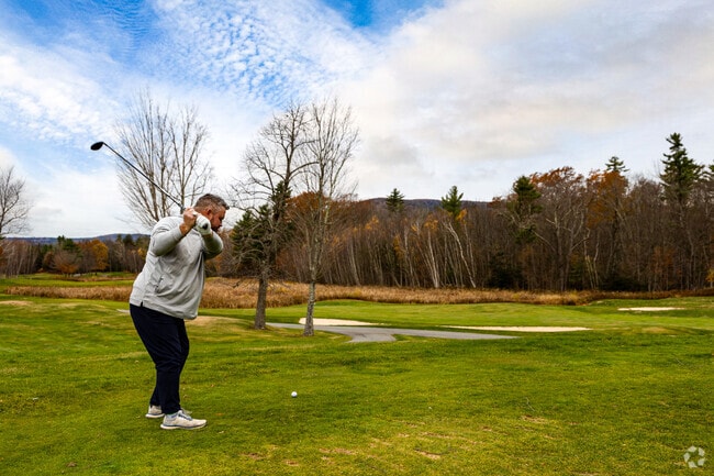 Golfers enjoy scenic Ossipee Mountain views at Birch Hill Country Club.