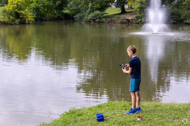 Evansville residents enjoy some fishing at the lake in Garvin Park.