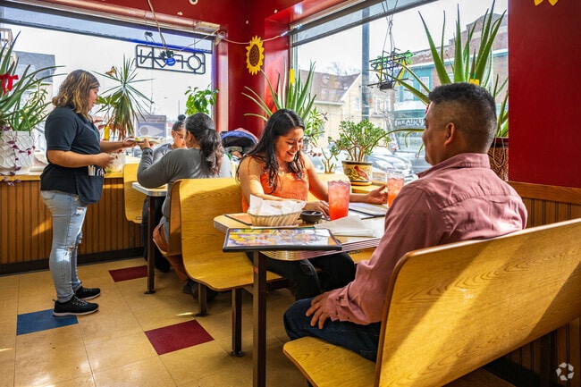 The warm sun lit interior of Restaurant Y Taqueria La Esperanza in Muskego Way neighborhood.