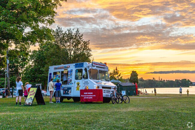 People order ice cream at sunset while at The Movies By The Lake in Downtown Wakefield.