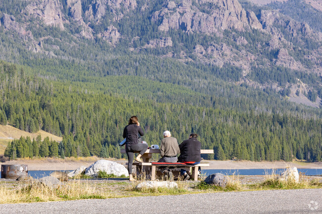A family enjoys lunch at the  the Hyalite Reservoir near King Arthur Park.