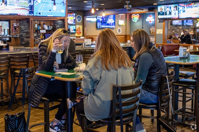 Friends enjoying time at Liberty's Putters Sports Grill.