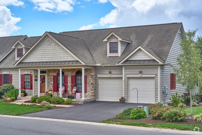 These two story duplex homes offer a two car garage.