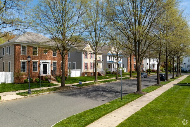 Single family homes and trees line the street in Robbinsville.