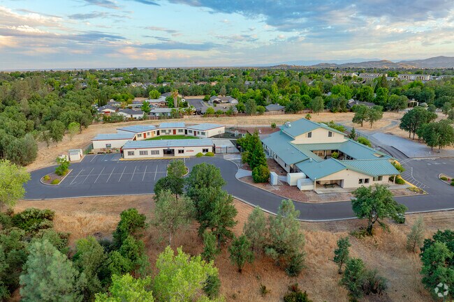 Shasta County Independent Study is surrounded by mature trees.