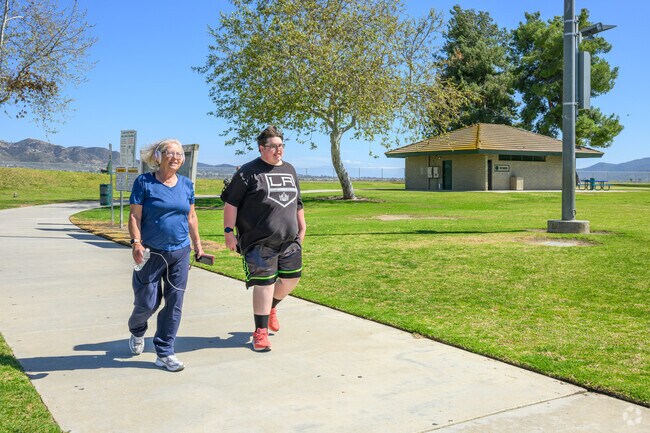 Riverview residents enjoy a nice stroll through the neighborhood at Lakepoint Park.