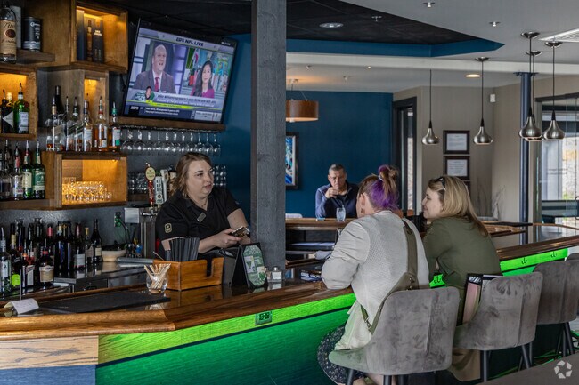 Get a cocktail or dinner at Lakepoint Restaurant on Lake Lomond.