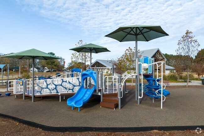 Clover families enjoy the large spaces and beautiful playground of New Centre Park.