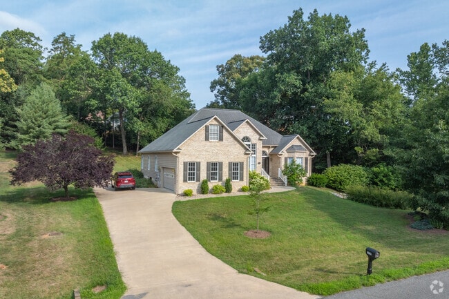 New Traditional properties with tan stone facades and gabled roofs are found in Lakewood.