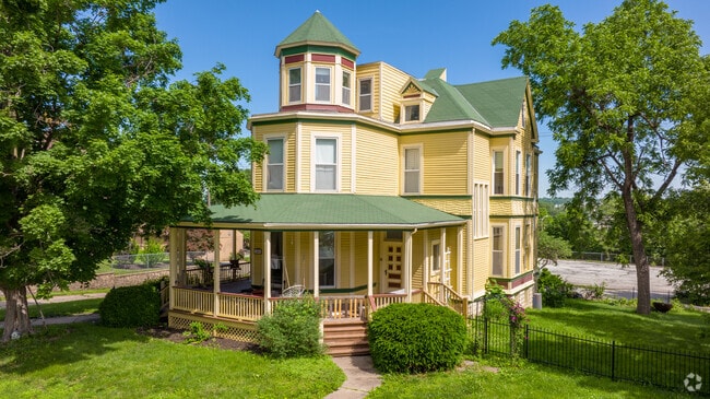 3 story Victorian with wrap-around porches have corner lots in Kansas City.