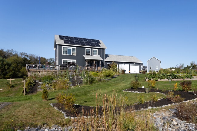 Contemporary homes in Durham, ME, offer sleek designs and open floor plans while maintaining harmony with the natural surroundings.