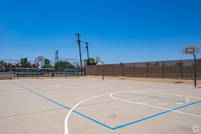 Play basketball on the court at Richard E Miller School in Phoenix.