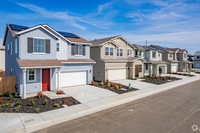 New two-story town houses in Shannon Ranch have small front yards and solar panels.