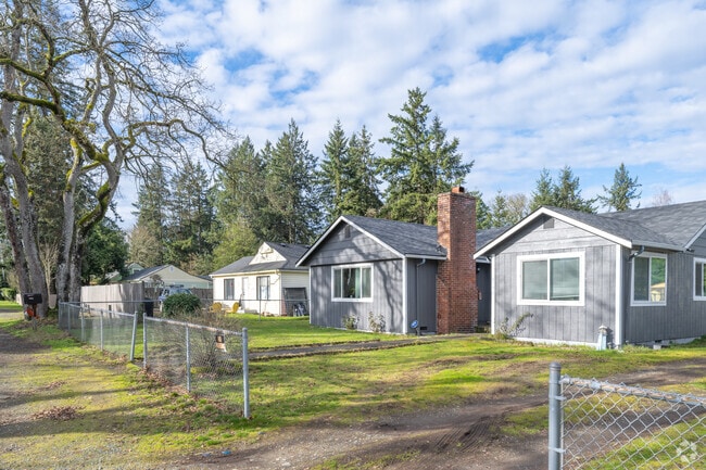 Lakewood homes are often surrounded by greenery and mature fir trees.