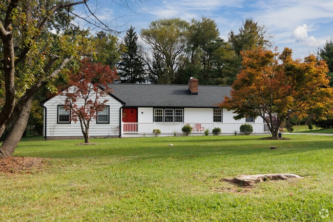 This rancher may be smaller than the neighbors, but it still sits on several acres of land.
