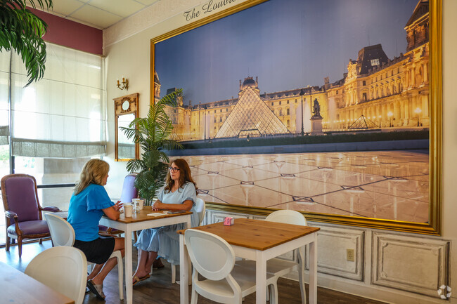 Friends meet for coffee and pastries at Le Louvre French Cafe in Shadow Ridge.