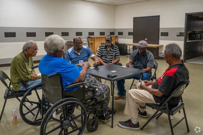 Play a game of cards at McAlpine Park Recreation Center in Sherman Heights.