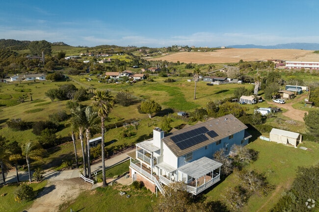 Modern farm house styled homes with sweeping views of South Morro Hills.