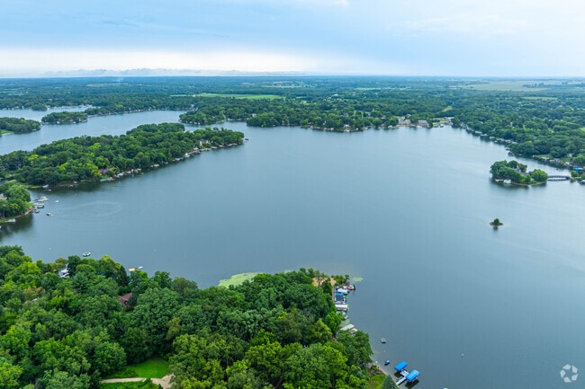 Sparkling Lauderdale Lakes stretches across a patchwork of trees and shoreline.