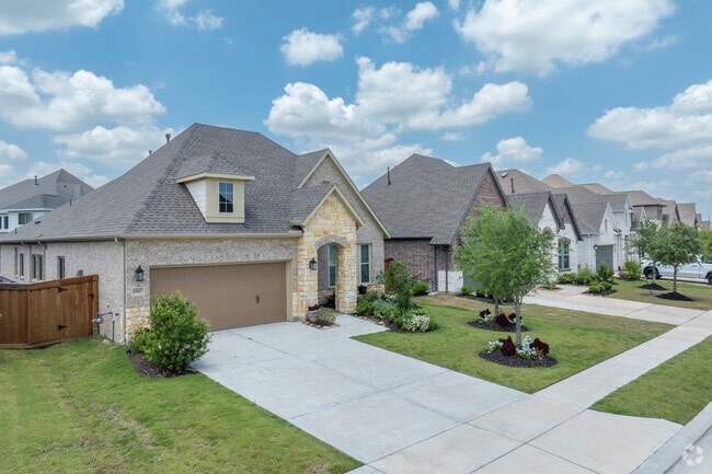 Dunham Pointe's neighborhood fills with graceful new traditional homes.