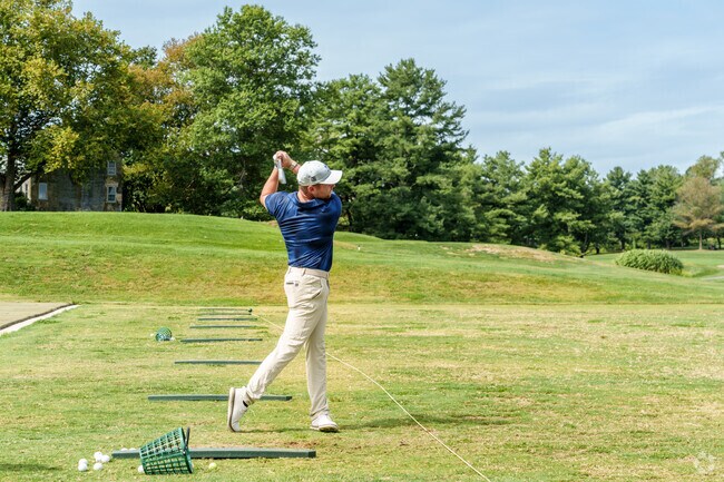 Chesapeake Bay Golf Club near Rising Sun offers a driving range and scenic fairways.