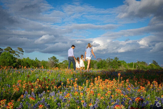 Residents stroll along the bayou in Lazybrook-Timbergrove.