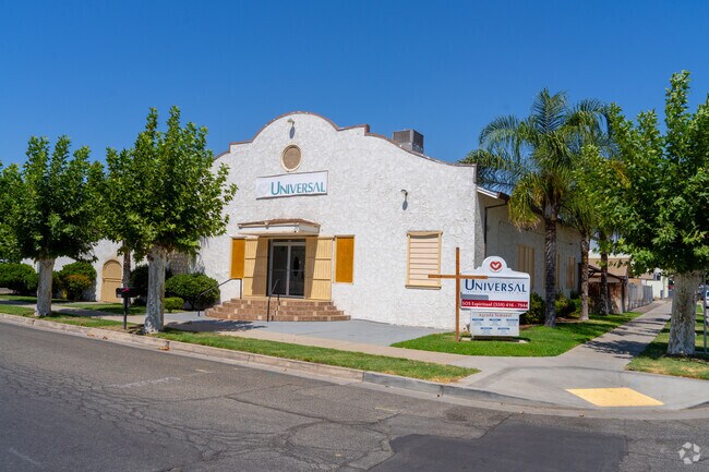 Visitors gather near the cross outside Universal Church in North Madera for a community service.