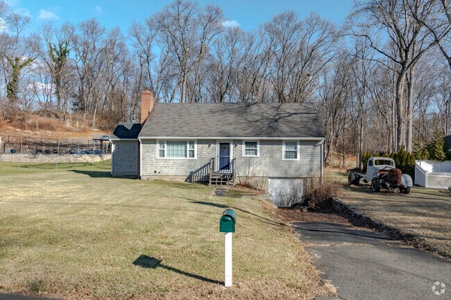 A cute ranch home in Fairfield Woods with motorized yard decorations.