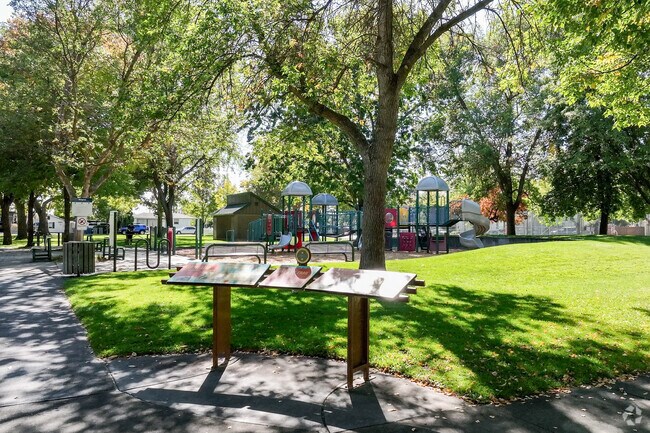 Fairview Park provides plenty of shade for children playing on the playground.