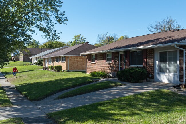 Madden Hill offers a modest landscape with simple homes and grass lawns.