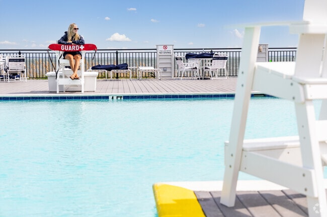 The pool at Marina Club in Captain's Cove invites relaxation with stunning Chincoteague Bay views in Greenbackville.