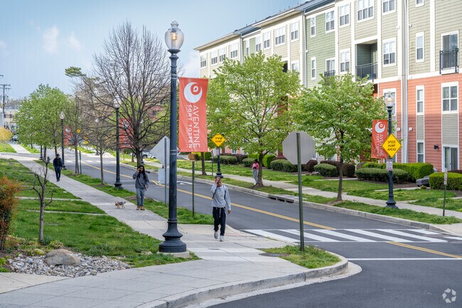 Fort Totten residents take a stroll among the new build row homes by the Fort Totten Metro.