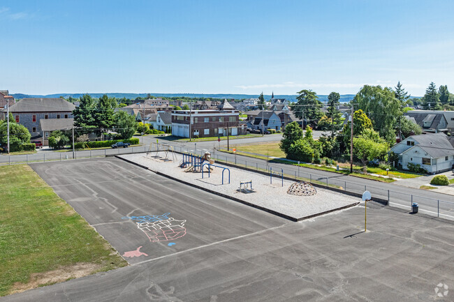 An outdoor paved sports area and a gravel playground are available at Central Elementary School.