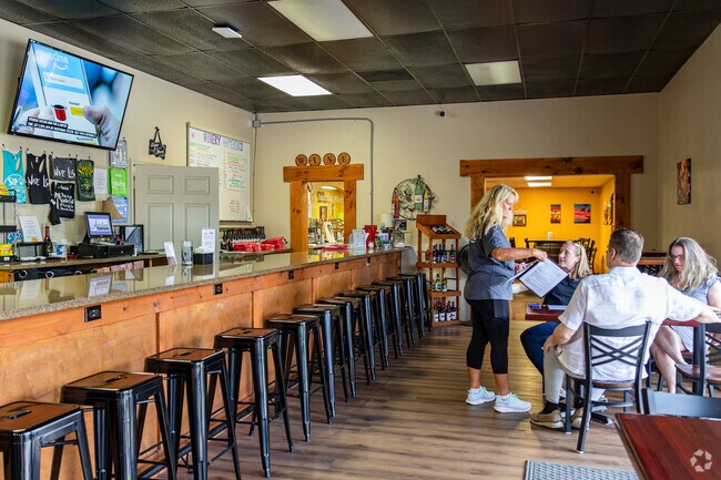 Brigadoon of Clearwater residents enjoy trying out wine variations with witty names at Aspiration Winery.