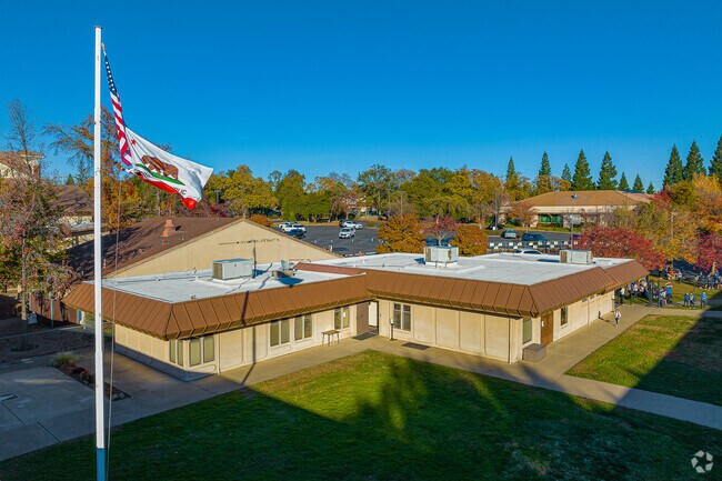 Flags fly in the wind at St. Joseph Catholic School.