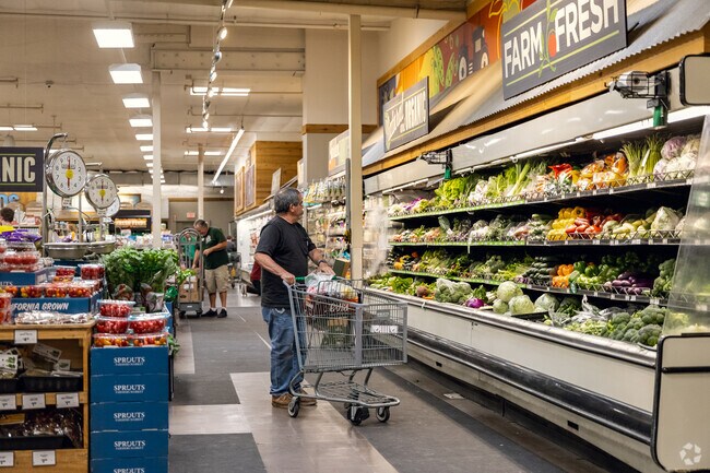 A customer browses the produce section at Sprouts near Granite Hills.