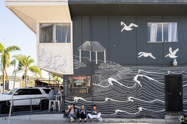These locals are enjoying some ice cream on the curb in Beach Barber Tract.