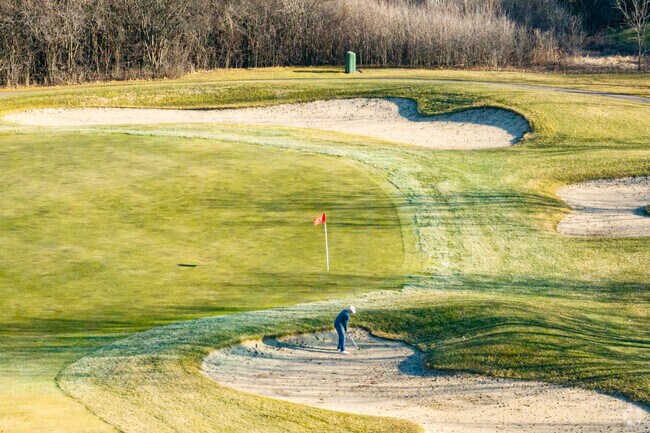 Golfers swing for the green at Libertyville's Pine Meadow Golf Club.