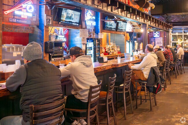 Grab a drink with friends at Moe's BBQ near The Preserve.