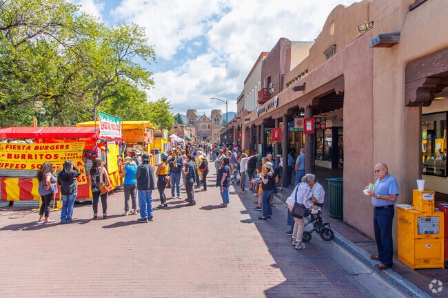 Visitors line the streets Santa Fe Plaza near Tres Arroyos.