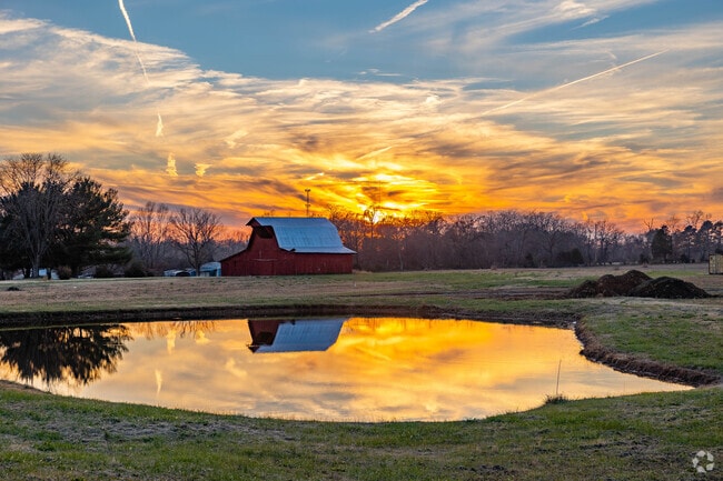 Some residents of Cross Plains have large red barns that reflect on lakes in Cross Plains.